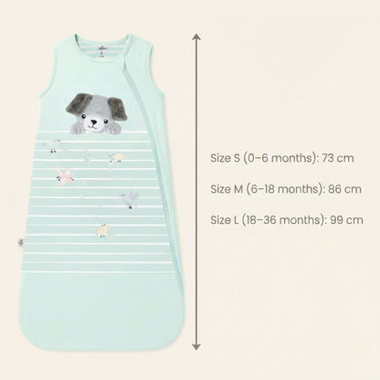 Zelkii® baby sleep sack size and fit chart showing total length measurements. Size S (0–6 months) measures 73 cm, Size M (6–18 months) measures 86 cm, and Size L (18–36 months) measures 99 cm, displayed alongside a cream sleep sack with puppy illustration.