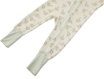 Detail shot of the Zelkii bamboo pyjamas in a yellow and cream stripe, focusing on the bunny embroidered on design.