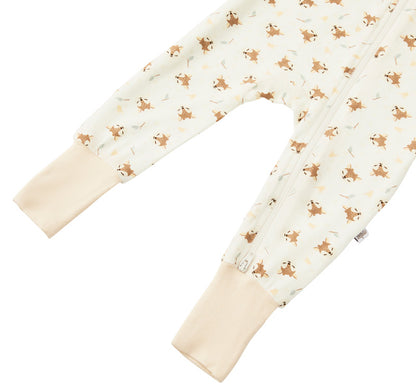 Detail shot of the Zelkii bamboo pyjamas in a blue and white stripe, focusing on the fawn on design.