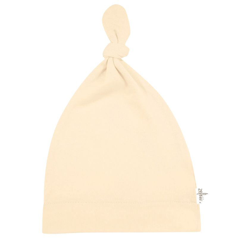 Zelkii cream-coloured bamboo baby beanie with top knot"