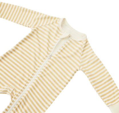 A flat lay of the Zelkii bamboo baby pyjama, showing the yellow and cream striped pattern and long sleeves.