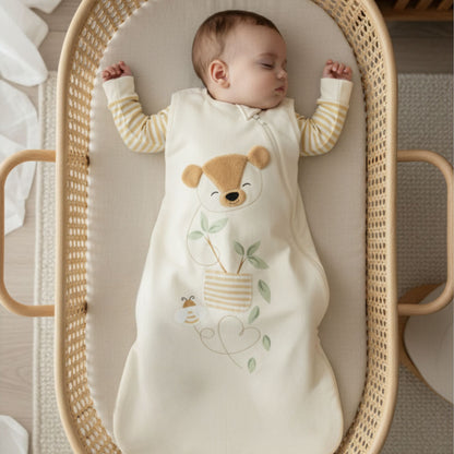 Zelkii baby sleeping in a bamboo sleep sack with a teddy bear design"