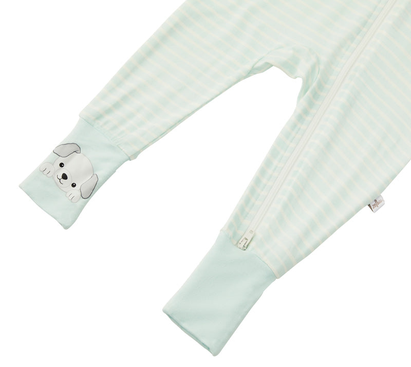 Detail shot of the Zelkii bamboo pyjamas in a blue and white stripe, focusing on the puppy embroidered on the cuff.